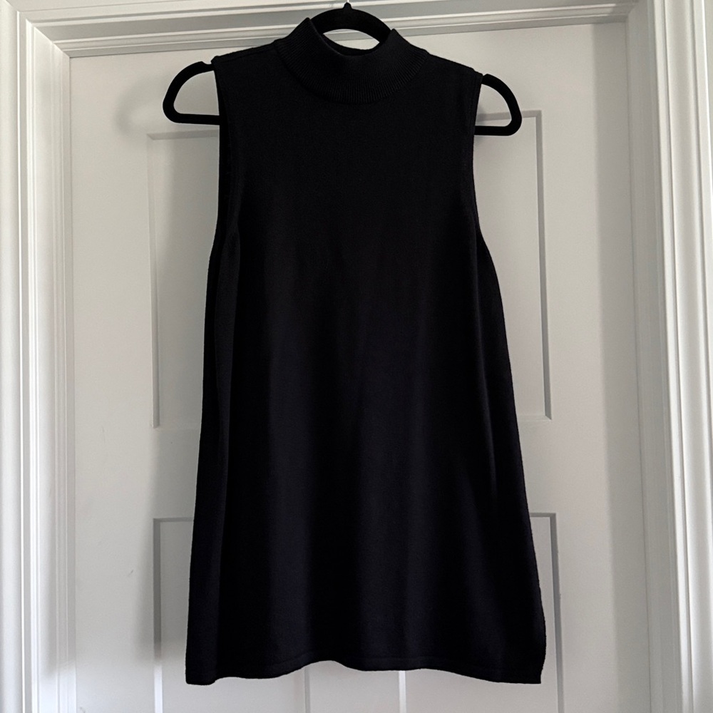 Chico's Elegant Black Knit Top. Sleeveless size 1. Slits on sides.